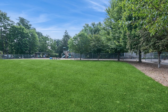 view of yard with fence and playground community