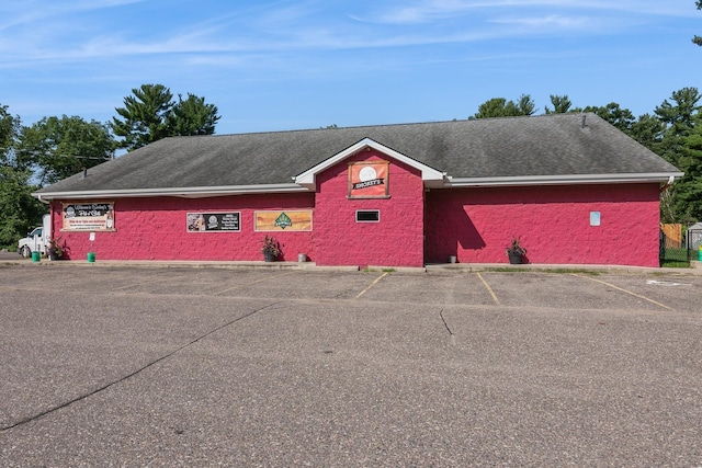 view of property with uncovered parking