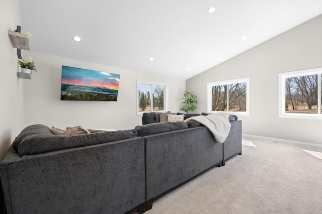 living area featuring recessed lighting, lofted ceiling, baseboards, and light colored carpet
