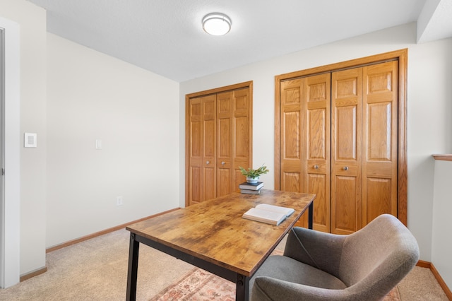 office space with light colored carpet and baseboards