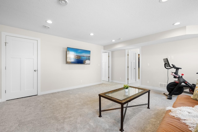 living room featuring light colored carpet, baseboards, visible vents, and recessed lighting