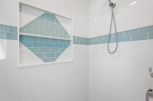 full bathroom with a tile shower