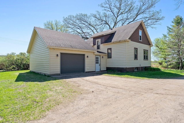 100 Stark Rd, Harris, MN 55032 - view of front of home featuring a shingled roof, an attached garage, driveway, and a front yard