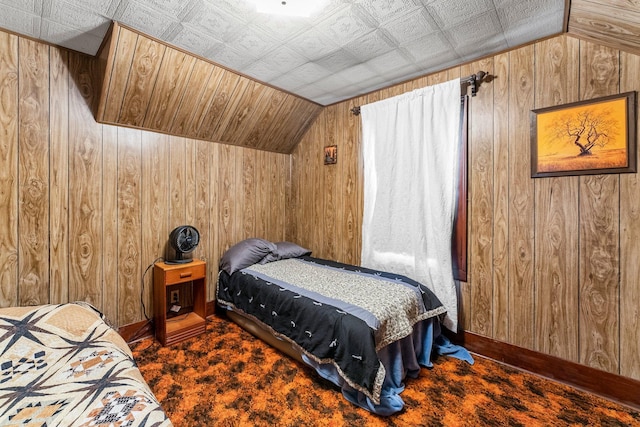 100 Stark Rd, Harris, MN 55032 - carpeted bedroom with wood walls and lofted ceiling