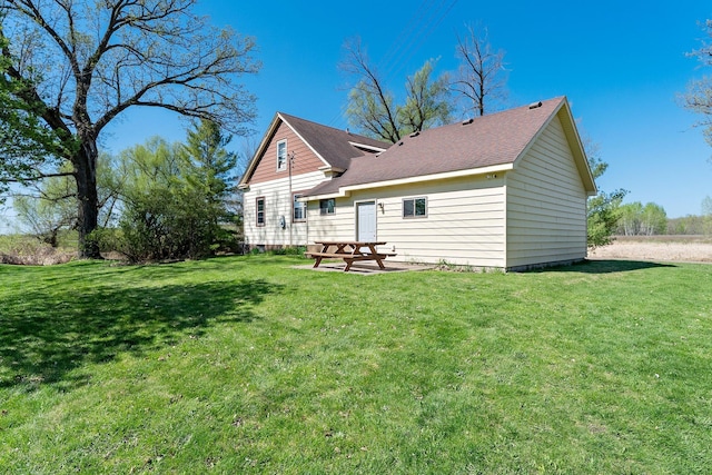 100 Stark Rd, Harris, MN 55032 - rear view of property featuring a yard and a shingled roof