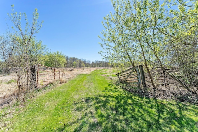 100 Stark Rd, Harris, MN 55032 - view of yard featuring a rural view and fence