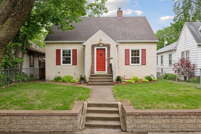view of front facade with a chimney, roof with shingles, and stucco siding