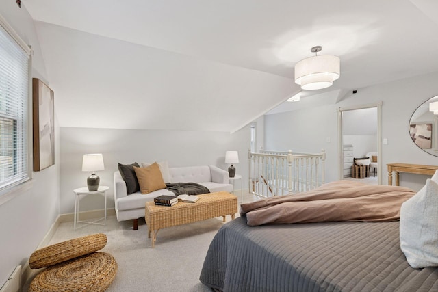 carpeted bedroom with vaulted ceiling