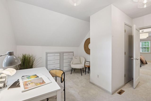 office featuring light carpet and lofted ceiling