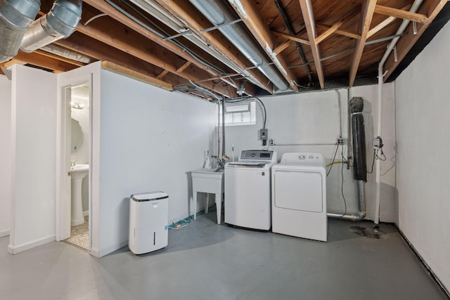 basement with washing machine and clothes dryer