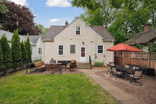 rear view of property featuring entry steps, outdoor lounge area, a patio area, stucco siding, and central AC unit