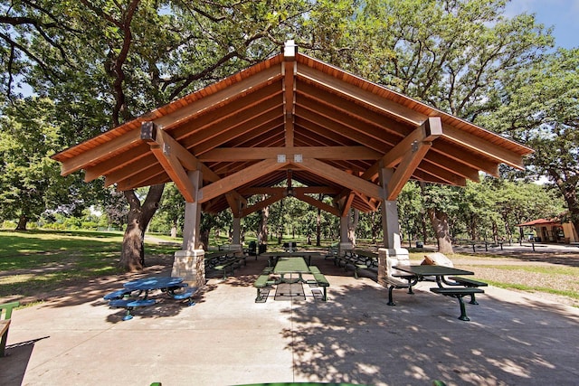 view of property's community with a gazebo and view of wooded area