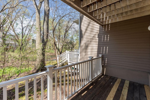 wooden deck featuring stairs