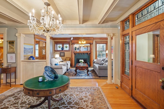 1767 Fremont Ave S, Minneapolis, MN 55403 - living room featuring decorative columns, a chandelier, wood finished floors, ornamental molding, and beam ceiling