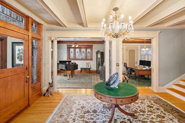 1767 Fremont Ave S, Minneapolis, MN 55403 - entrance foyer with light wood-style floors, ornamental molding, a chandelier, beamed ceiling, and plenty of natural light