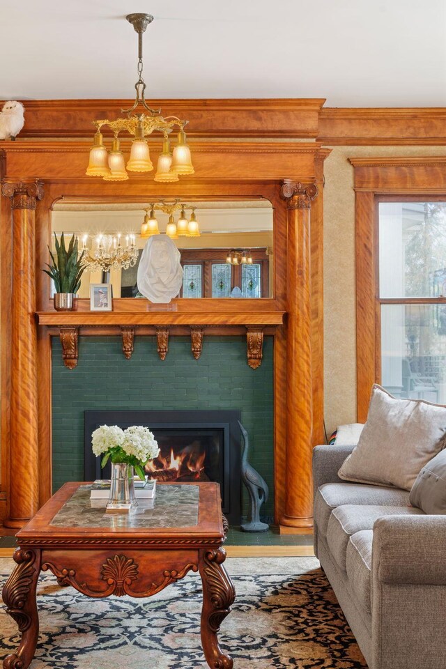 1767 Fremont Ave S, Minneapolis, MN 55403 - living room featuring a tile fireplace and a chandelier