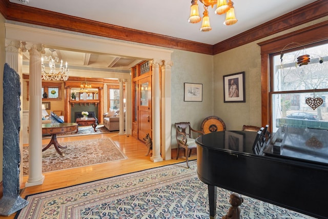 1767 Fremont Ave S, Minneapolis, MN 55403 - office space with a chandelier, decorative columns, wood finished floors, crown molding, and plenty of natural light