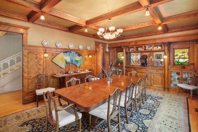 1767 Fremont Ave S, Minneapolis, MN 55403 - dining space with hardwood / wood-style floors, coffered ceiling, beam ceiling, a chandelier, and stairs