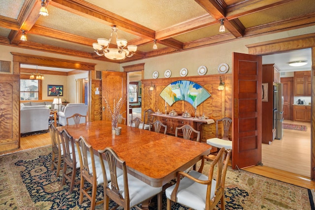 1767 Fremont Ave S, Minneapolis, MN 55403 - dining room with a chandelier, coffered ceiling, light wood-type flooring, plenty of natural light, and beamed ceiling