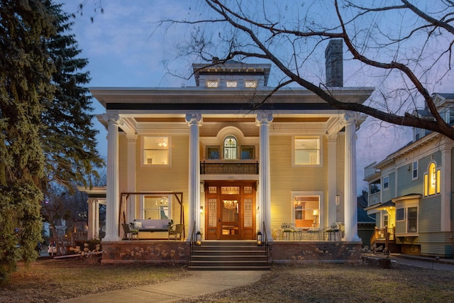 1767 Fremont Ave S, Minneapolis, MN 55403 - view of front facade featuring a porch and a chimney