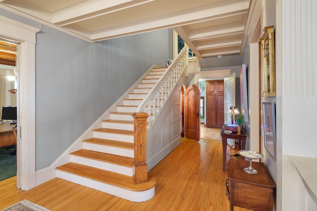 1767 Fremont Ave S, Minneapolis, MN 55403 - stairs with hardwood / wood-style flooring, crown molding, and beamed ceiling
