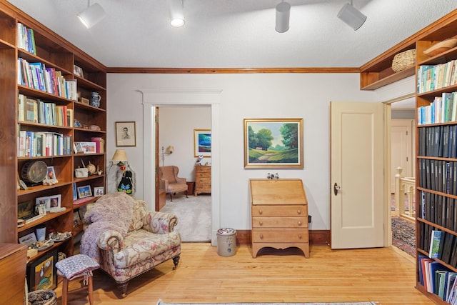 1767 Fremont Ave S, Minneapolis, MN 55403 - living area featuring ornamental molding, light wood-type flooring, and a textured ceiling