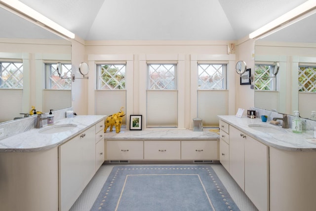 1767 Fremont Ave S, Minneapolis, MN 55403 - full bath with lofted ceiling, two vanities, and healthy amount of natural light
