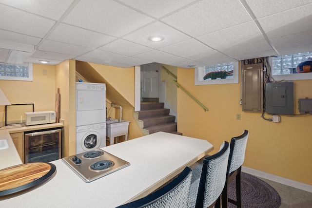 1767 Fremont Ave S, Minneapolis, MN 55403 - tiled office with wine cooler, estacked washer and dryer, electric panel, and a drop ceiling