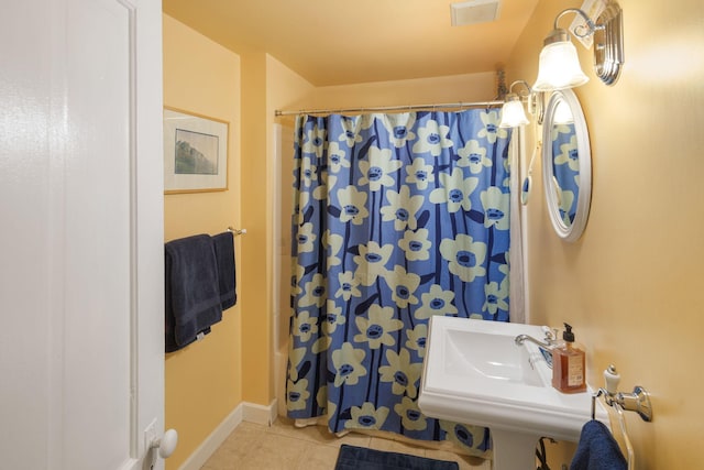 1767 Fremont Ave S, Minneapolis, MN 55403 - bathroom with tile patterned flooring and a shower with shower curtain
