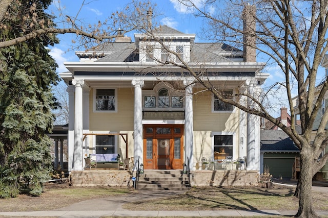 1767 Fremont Ave S, Minneapolis, MN 55403 - neoclassical home with a porch, a chimney, a garage, and roof with shingles