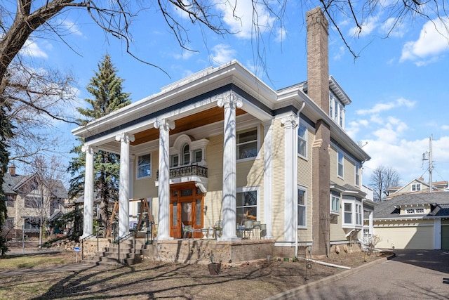 1767 Fremont Ave S, Minneapolis, MN 55403 - neoclassical home with a porch, a chimney, and a balcony
