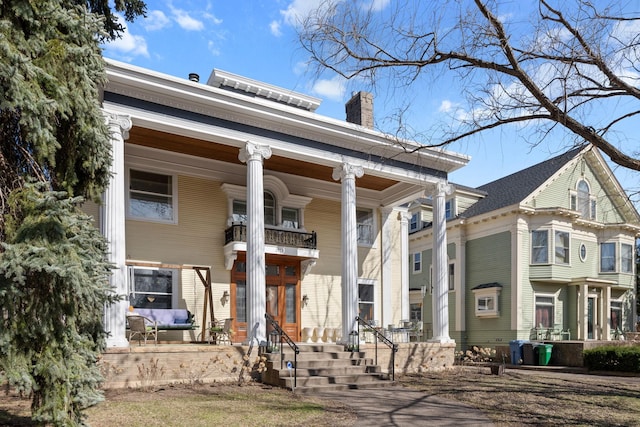 1767 Fremont Ave S, Minneapolis, MN 55403 - neoclassical home featuring a porch, a chimney, and a balcony