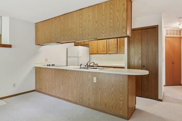 3635 Saint Francis Way Unit B, Eagan, MN 55123 - kitchen with freestanding refrigerator, light carpet, black electric stovetop, a peninsula, and light countertops
