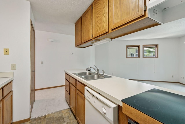 3635 Saint Francis Way Unit B, Eagan, MN 55123 - kitchen with white dishwasher, black electric stovetop, brown cabinetry, and light countertops