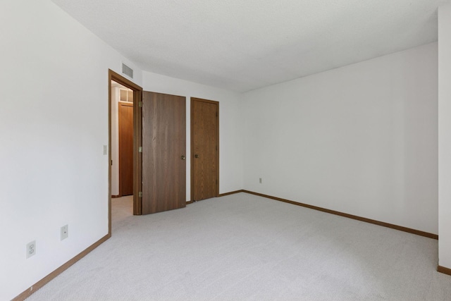 3635 Saint Francis Way Unit B, Eagan, MN 55123 - unfurnished bedroom featuring light colored carpet and a closet