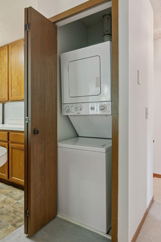 3635 Saint Francis Way Unit B, Eagan, MN 55123 - washroom featuring stacked washer / dryer and light carpet