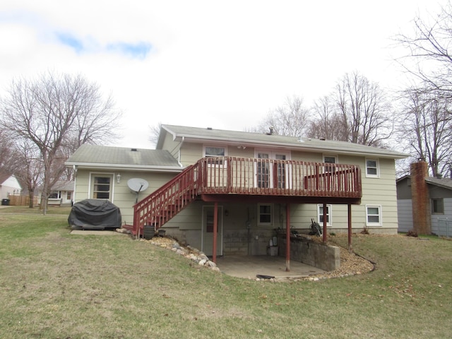 back of property with a patio area, a lawn, cooling unit, stairs, and a wooden deck