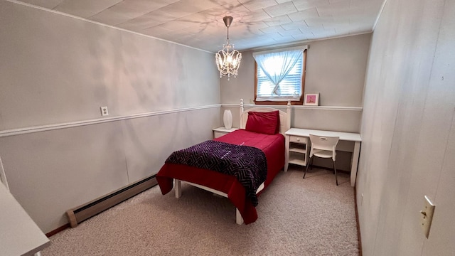 bedroom featuring a baseboard radiator, an inviting chandelier, ornamental molding, and carpet floors