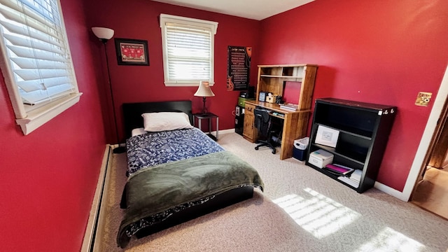bedroom with baseboards and carpet floors