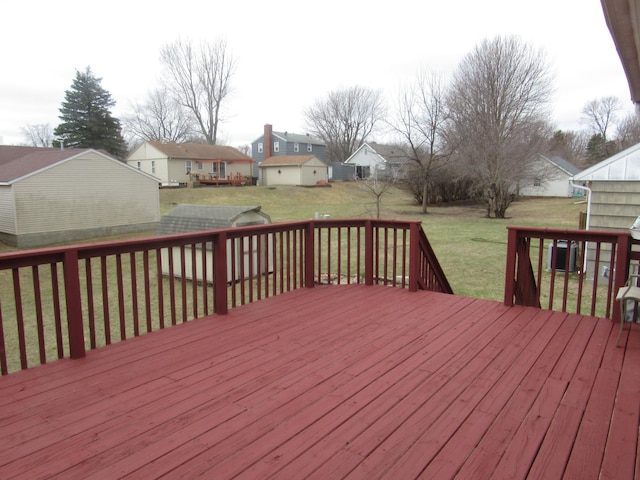 wooden terrace with a yard, cooling unit, and a residential view
