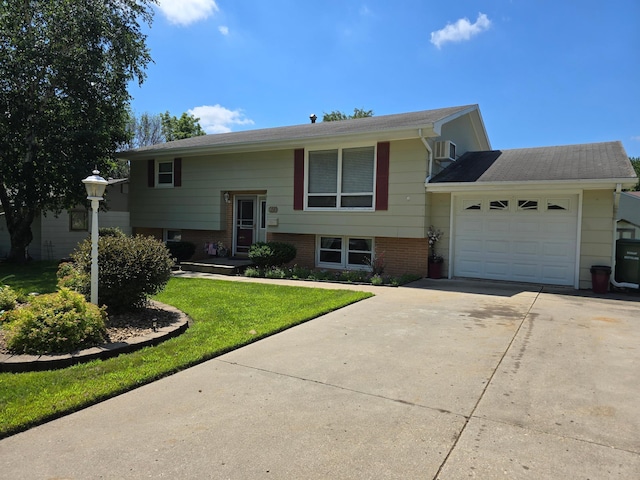 350 Lakehill Dr, Worthington, MN 56187 - raised ranch with an attached garage, driveway, a front lawn, and brick siding