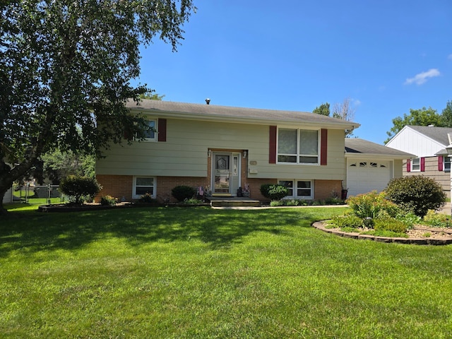350 Lakehill Dr, Worthington, MN 56187 - split foyer home featuring a garage and brick siding