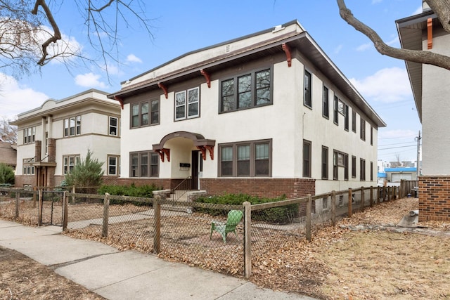 3542 Garfield Ave Unit 3, Minneapolis, MN 55408 - view of front of home with stucco siding, brick siding, and a fenced front yard