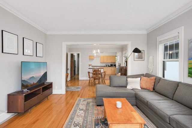 3542 Garfield Ave Unit 3, Minneapolis, MN 55408 - living area with crown molding, light wood finished floors, and a chandelier