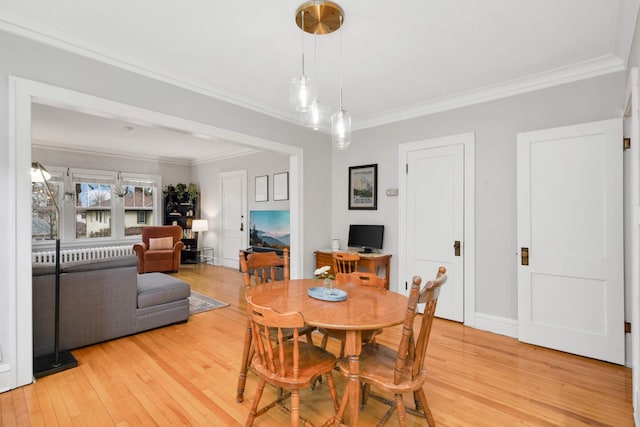 3542 Garfield Ave Unit 3, Minneapolis, MN 55408 - dining area featuring light wood-style flooring and ornamental molding