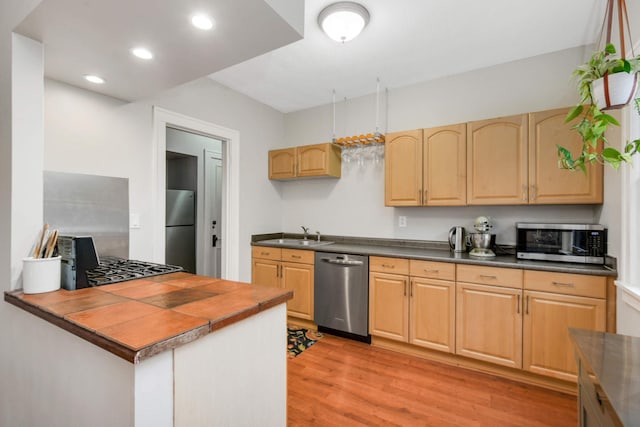 3542 Garfield Ave Unit 3, Minneapolis, MN 55408 - kitchen with appliances with stainless steel finishes, light wood-style flooring, light brown cabinets, dark countertops, and recessed lighting