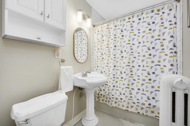 3542 Garfield Ave Unit 3, Minneapolis, MN 55408 - full bath featuring radiator heating unit, curtained shower, and tile patterned flooring