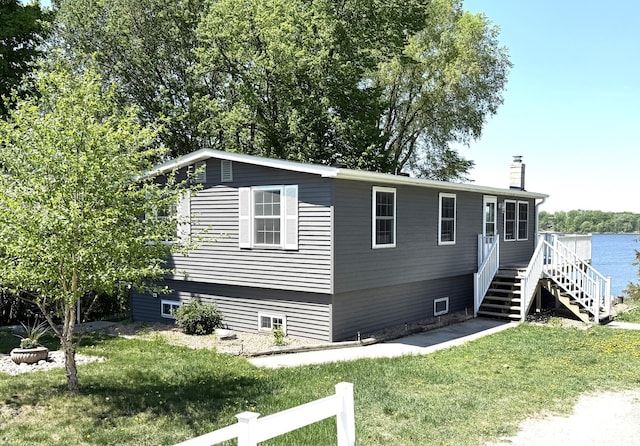 27447 742nd Ave, Dassel Twp, MN 55325 - view of front of home with a front yard, a chimney, and stairway