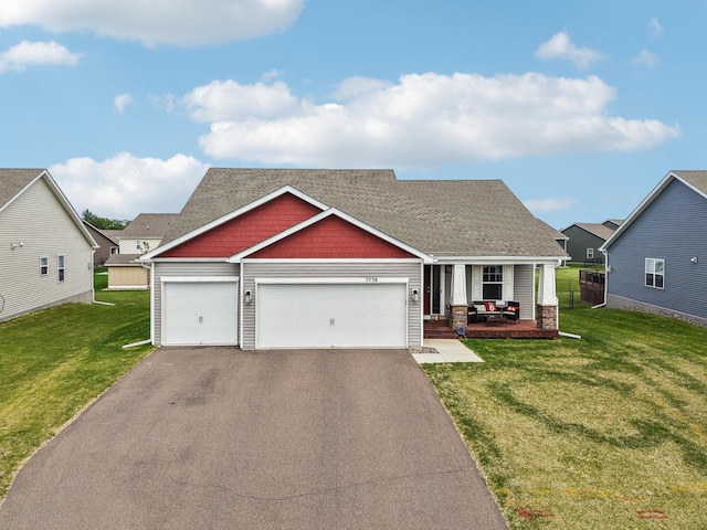 7538 Ochoa Ave NE, Otsego, MN 55330 - craftsman-style home with covered porch, a front yard, asphalt driveway, and an attached garage