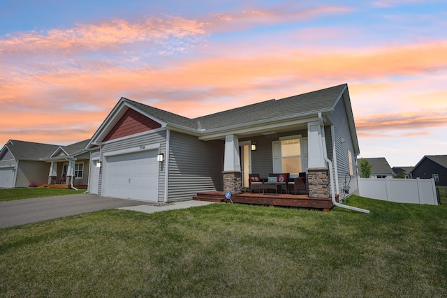 7538 Ochoa Ave NE, Otsego, MN 55330 - view of front of property with a porch, an attached garage, driveway, and stone siding